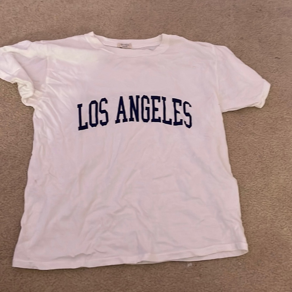 White short sleeve top with navy blue print